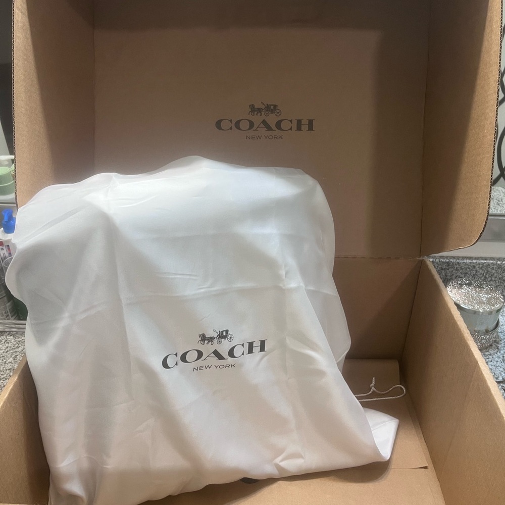 New, never used, still in packaging Coach Hall Tote